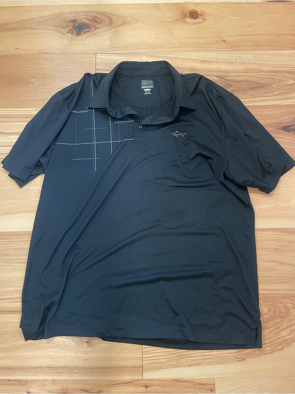 Greg Norman Collection Black Polo with Subtle Grid Accent